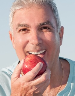 man eating apple 