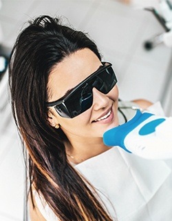 woman getting teeth whitening