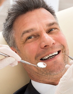 Man smiling at dentist getting dental crown in Mount Pleasant