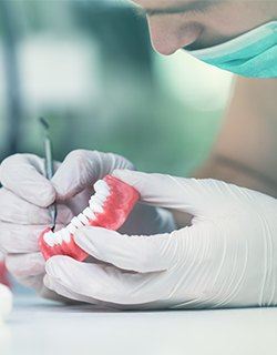 dentist working on prosthetics