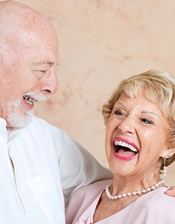 man and woman laughing