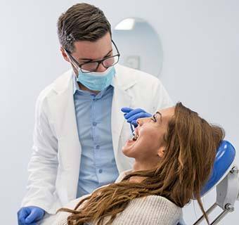 Emergency dentist in Mount Pleasant performing an exam