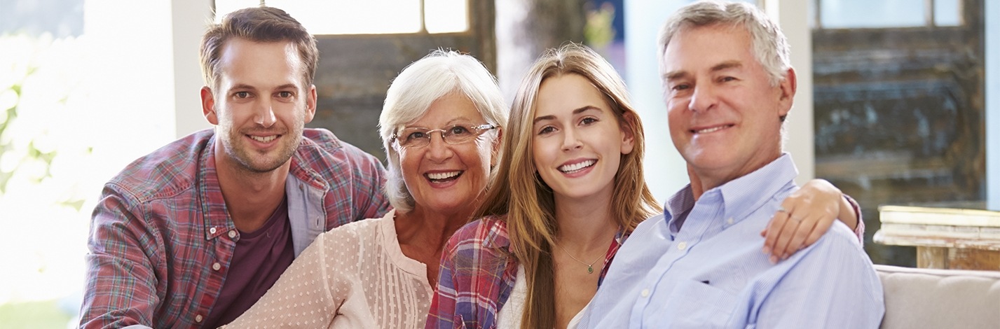 family of four smiling