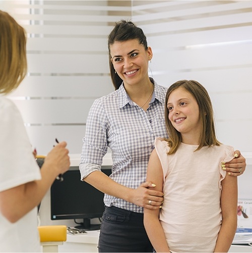 mother and daughter smiling