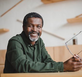 older man smiling with dental implants in Mount Pleasant
