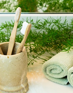 Bamboo toothbrushes in a cup holder