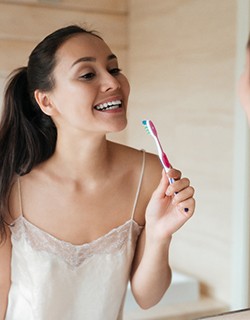 Woman holding a toothbrush