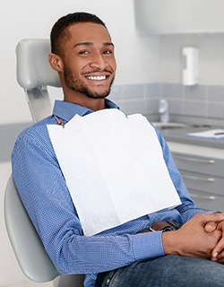 young man sitting in the dental chair