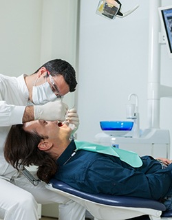 dentist examining a patient’s mouth