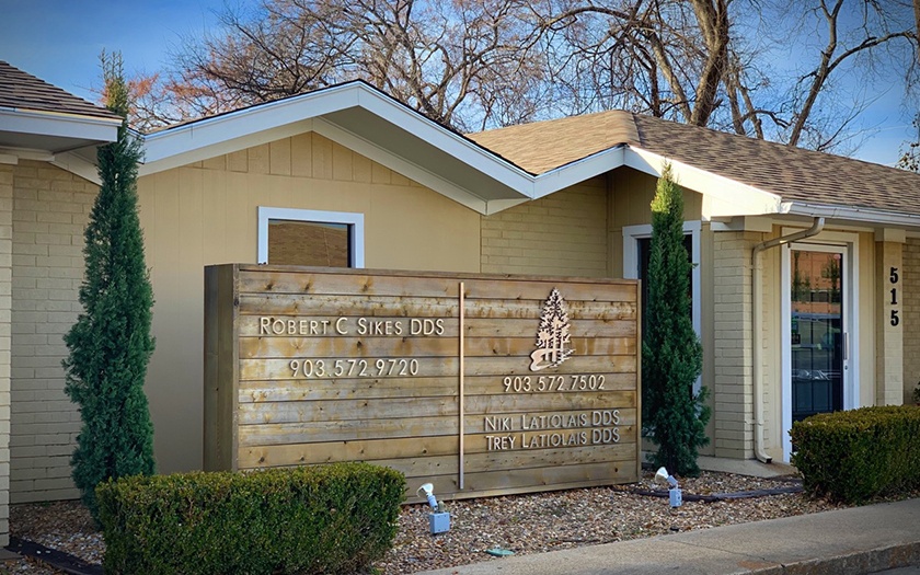 sign and trees outside office