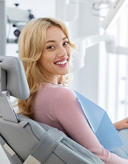 Closeup of smiling patient sitting in treatment chair