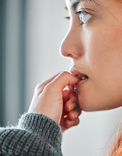 Closeup of woman biting their nails