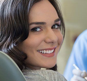 woman smiling over shoulder