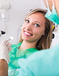 woman looking up at dentist