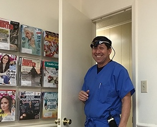 dentist with head lamp on