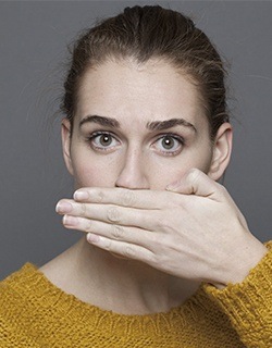 hand covering mouth