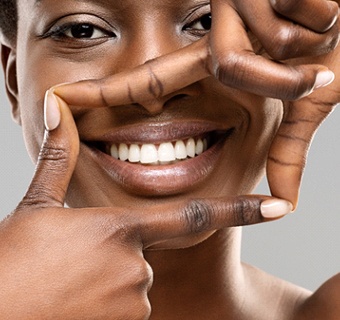 young woman smiling after teeth whitening in Mount Pleasant