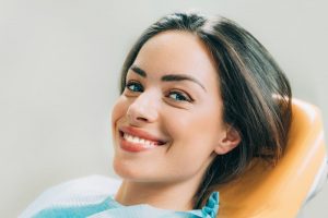 Woman smiling while visiting dentist in Mount Pleasant 
