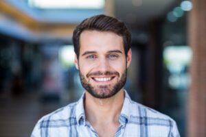 Man with a perfect smile after cosmetic dental work