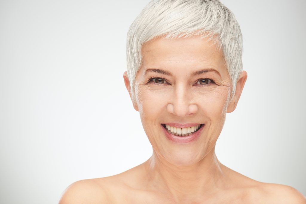 older woman smiling with beautiful teeth